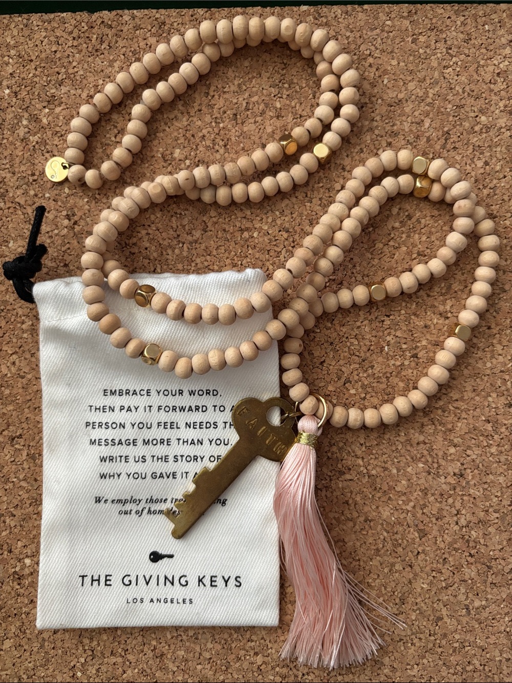The Giving Keys Natural Wood Bead Necklace with Pink Tassel and Brass Key